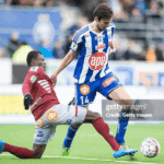 Placar eletrônico de futebol mostrando 'HJK Helsinki 0:3 FF Jaro', com escudos dos times e data de 11 MAI 2025.