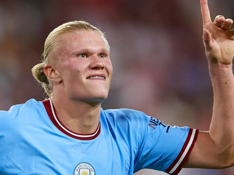 Haaland frustrado e Matheus Cunha celebrando em jogo da Premier League.